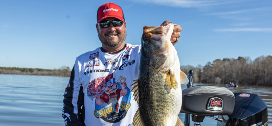 Fisherman holds his catch in from Tolendo Bend Lake.