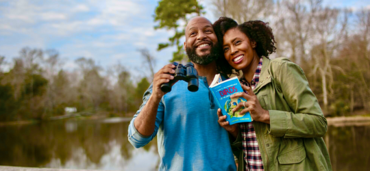 A man and a woman birdwatching in Louisiana.