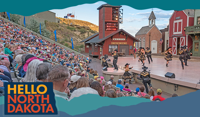 outdoor stage with performers dancing