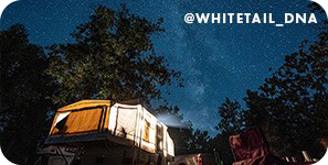 Camping tent in front of background of the night sky