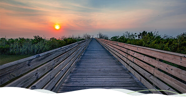Boardwalk with sunset behind