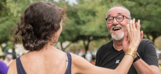 A man and a woman dance at the Shrimp & Petroleum Festival.