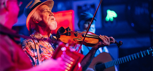 A musician plays the fiddle at Blue Moon Saloon in Lafayette.c