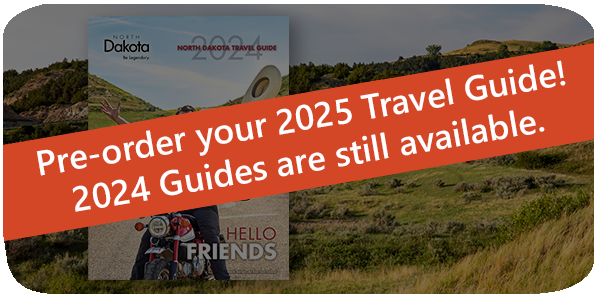 Red banner over an image that reads: Pre-order your 2025 Travel Guide! 2024 Guides are still available.