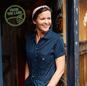 Cheesemaker entering her shop. 