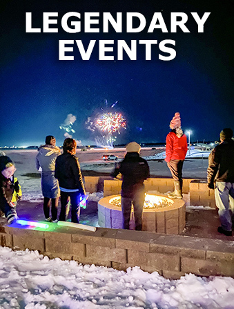 A group of people gathered around a fire pit on a snowy night and fireworks in the background, with overlay text that reads Legendary Events