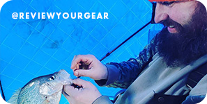 Bearded man removing a hook from a fish's mouth, with overlay text that reads @reviewyourgear