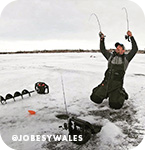 Man ice fishing on a frozen lake and pulling up fishing rods, with overlay text that reads @jobesywales