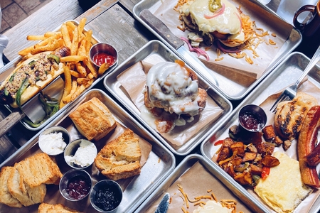 Several metal serving trays filled with brunch foods in Austin, Texas 