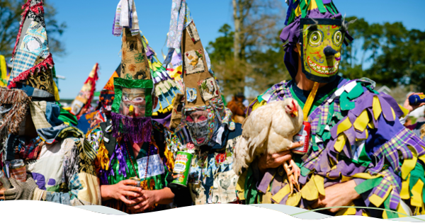 A group of men dressed in traditional Cajun Mardi Gras costumes.