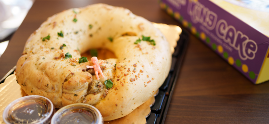 A picture of a crawfish-boudin king cake.