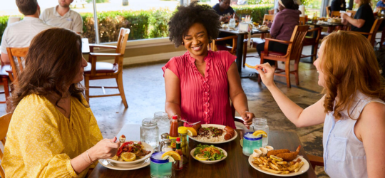 Three women dine at a restaurant in Shreveport, Louisiana.