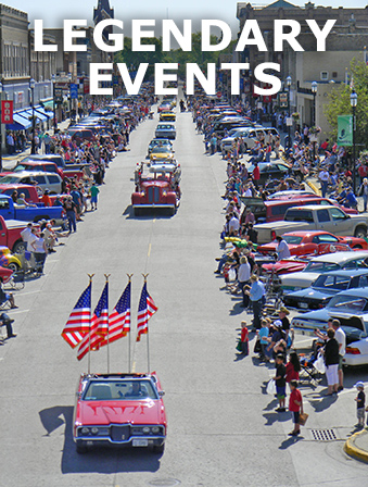 Aerial view of a classic-car parade, with overlay text that reads: Legendary Events