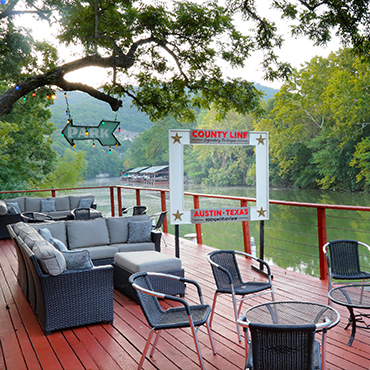 The outdoor creekside deck of The County Line Bar-B-Q in Austin, Texas