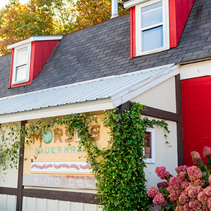Red building facade with sign that says 