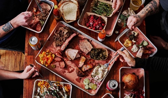 Platters of barbecue and sides served at Micklethwait Craft Meats in Austin, Texas