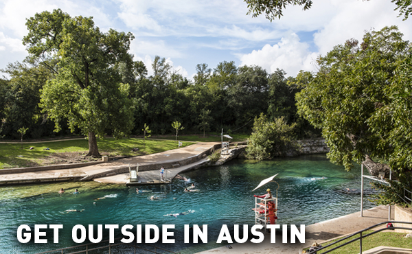 People swimming at the outdoor Barton Springs Pool in Austin, Texas