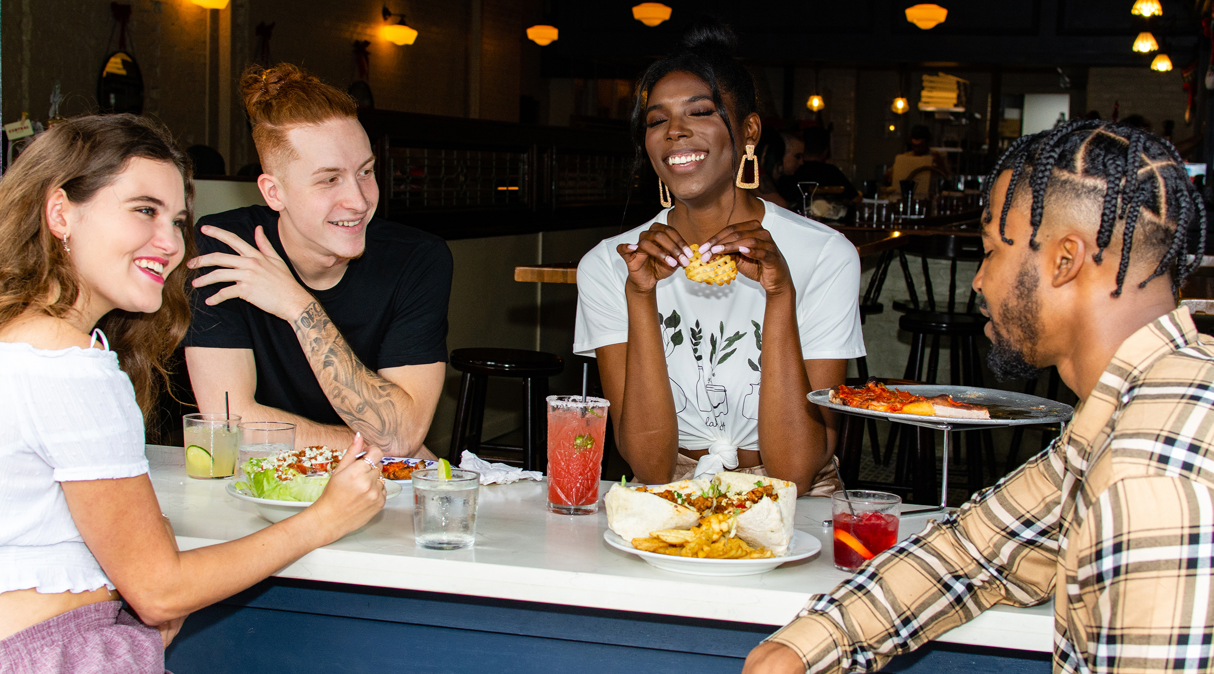 A group of people enjoy food in Lafayette.