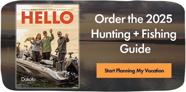Image of a travel guide cover with people on a boat and text that reads: Order the 2025 Hunting + Fishing Guide. Start Planning My Vacation