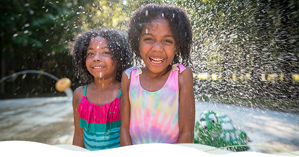 Two children enjoy playing outside in Louisiana.