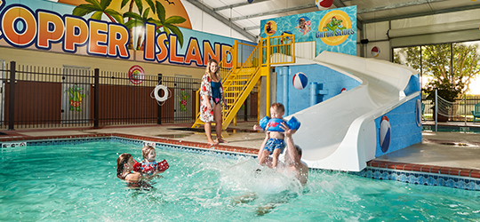 A family swims at a water park.