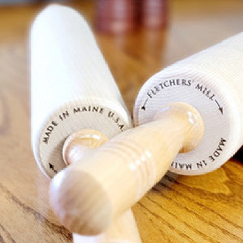 Two pastry rolling pins, stamped with 