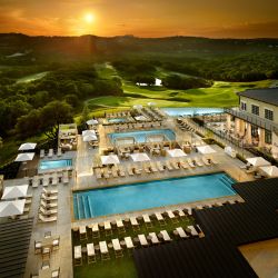 Aerial view of pools and the grounds of Omni Barton Creek Resort & Spa in the Texas Hill Country