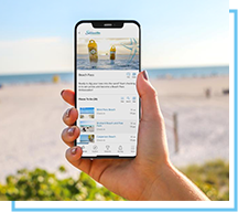 person holding iphone with beach pass app 