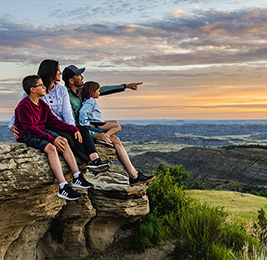 family viewing wide open spaces of mountains terrain