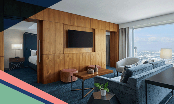 A view inside a contemporary guest room at JW Marriott Austin with separate living and sleeping spaces