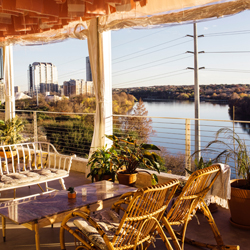 Views of Lady Bird Lake and the Austin skyline from the P6 rooftop bar at The LINE Austin hotel