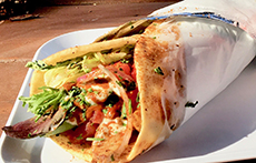 A pita wrap on a plate at kebabalicious