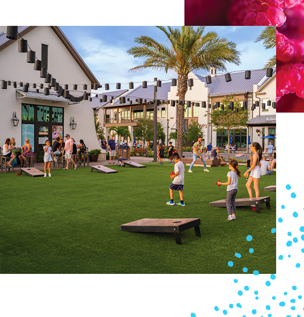 kids playing cornhole at waterside place lakewood ranch