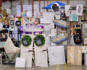 Crafts on display, including wood decor items