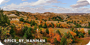 Panoramic view of rock formations and green and orange trees, with overlay text that reads: @pics_by_hannah