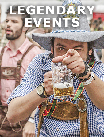 Man dressed in an Oktoberfest costumer holding a stein of beer while winking and pointing at the camera, with overlay text that reads: Legendary Events