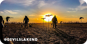 Silhouette of people walking through a field at sunset, with overlay text that reads: @devilslakend