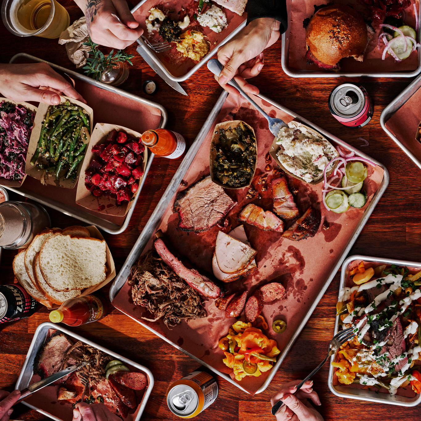 Platters filled with meats and side items served at Micklethwait Craft Meats in Austin, Texas