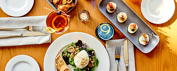 Table scape with appetizers and salad