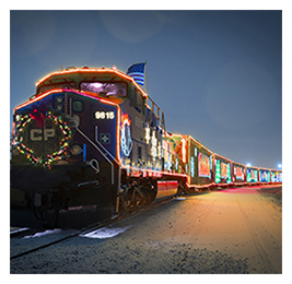 A train at night decorated with holiday lights
