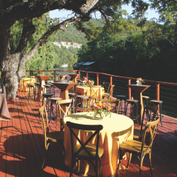 Creekside view from an outdoor dining deck at The County Line on the Lake, Austin, Texas