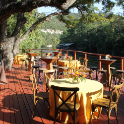 Creekside views from an outdoor deck at The County Line Bar-B-Q, Austin, Texas