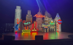 Stage set with colorful cityscape and neon signs at ACL Live at The Moody Theater in Austin, Texas
