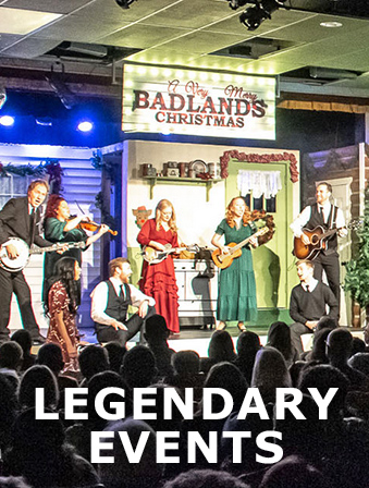 A group of men and women playing instruments on a stage under a sign that reads 