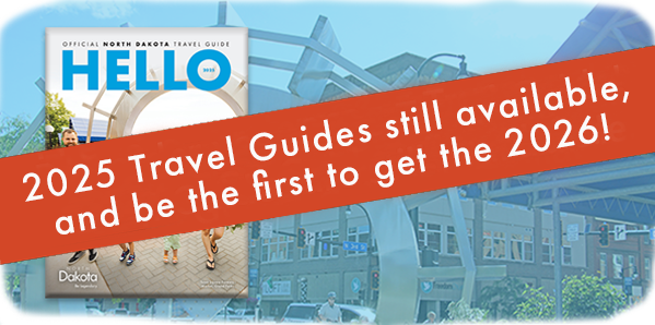 Background image of a travel guide with a red banner across and white text that reads: 2025 Travel Guides still available, and be the first to get 2026!