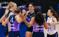 LOVB Austin pro volleyball team members celebrate on the court