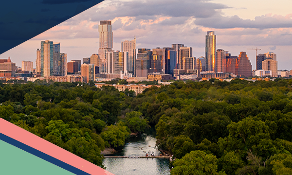 Aerial view of Barton Springs Municipal Pool surrounded by trees in Zilker Park with the Austin skyline in the backyard