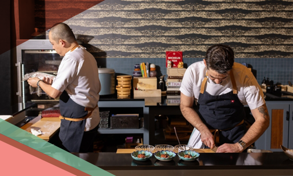 Two chefs prepare dishes in the kitchen of Craft Omakase, a fine dining Japanese restaurant in Austin, Texas
