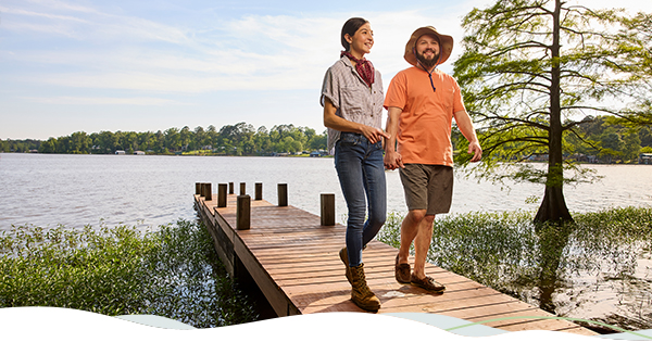 Two people walking on a dock