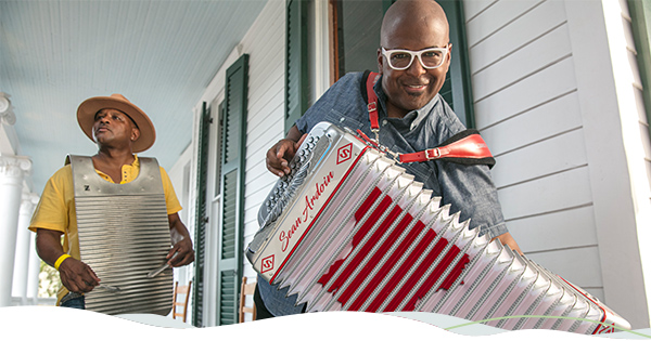 Two musicians play traditional Zydeco music.